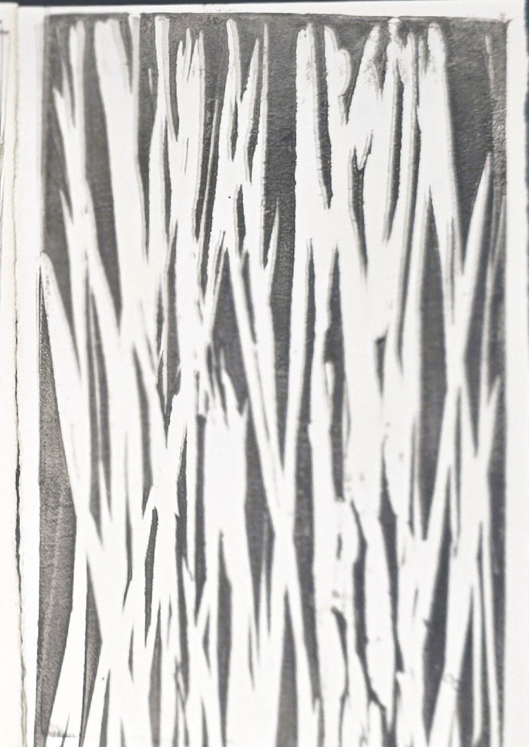 Abstract black and white monoprint with jagged vertical streaks.