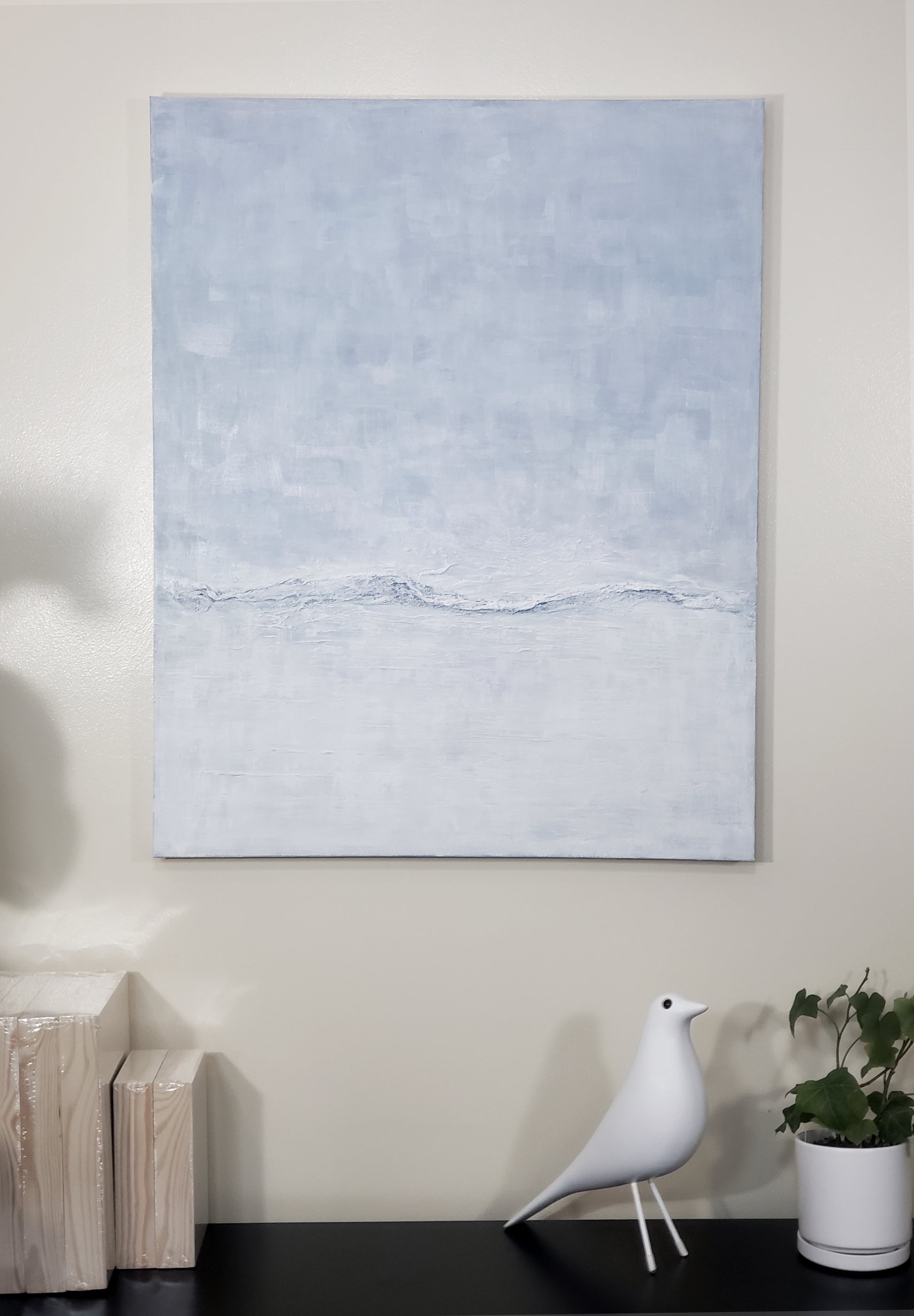 Restorative Roller Original Fine Art Painting by Carrie Bergey mounted on a wall above a shelf with minimalist decor, perfect for tranquil home styling.