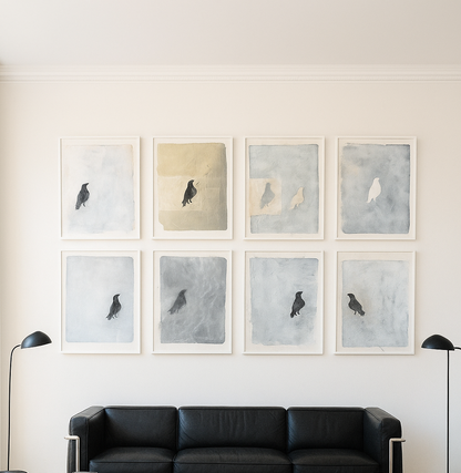 Raven Original Fine Art Monoprint Octaptych Collection by Carrie Bergey displayed above a black leather sofa in a modern living room. Ideal for home decor with symbolic raven imagery.