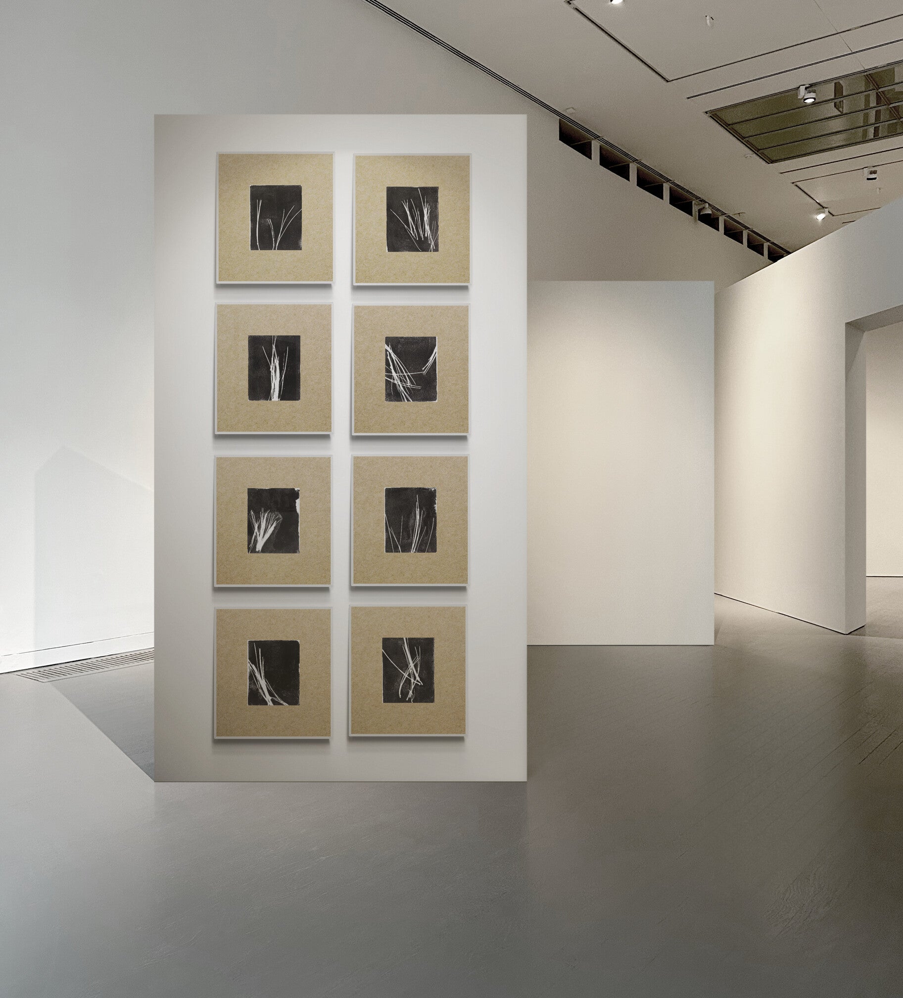 Pine Needles Monoprint Octaptych by Carrie Bergey displayed in a modern gallery with natural matting and black square prints.
